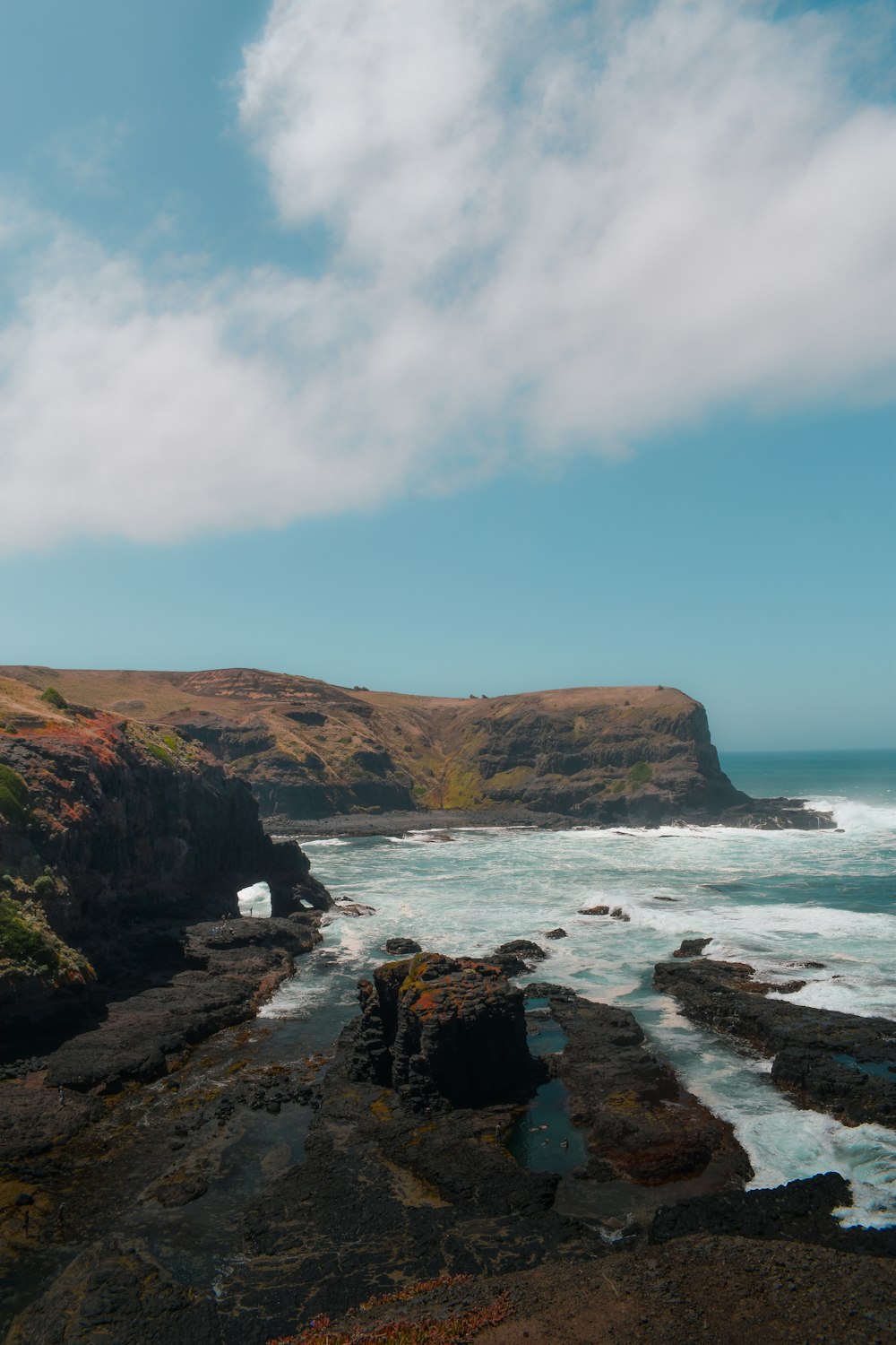 a rocky coastline with a body of water