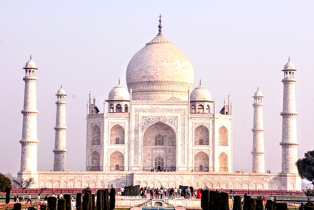 a large white building with many pillars and arches