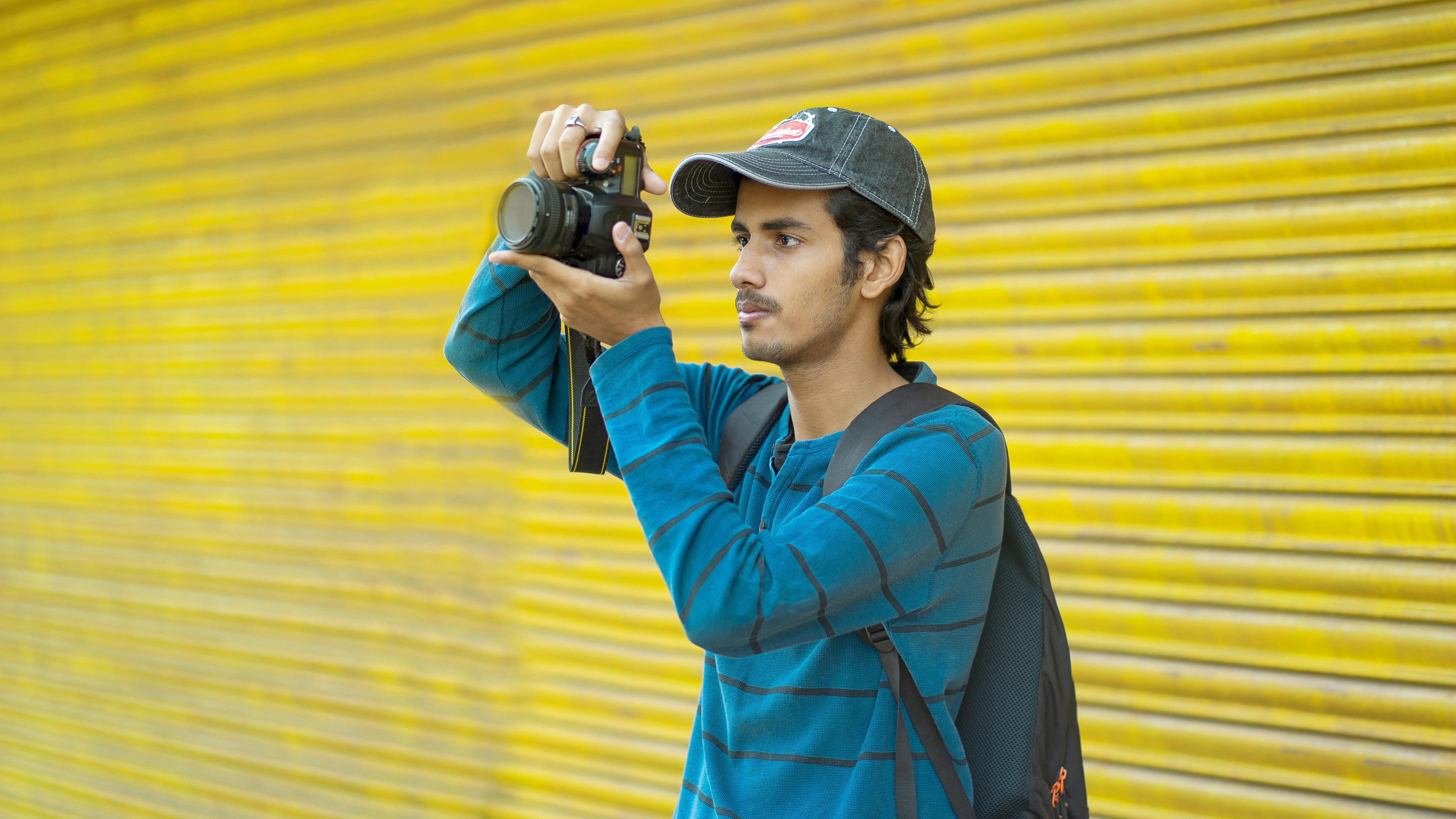 a man holding a camera up to take a picture