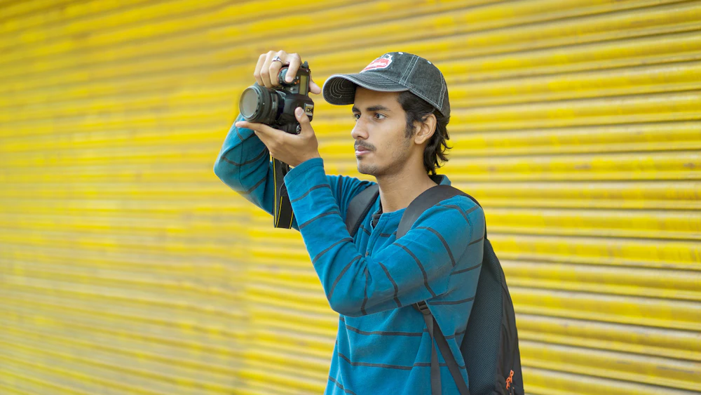 A photographer raising his camera to take a picture