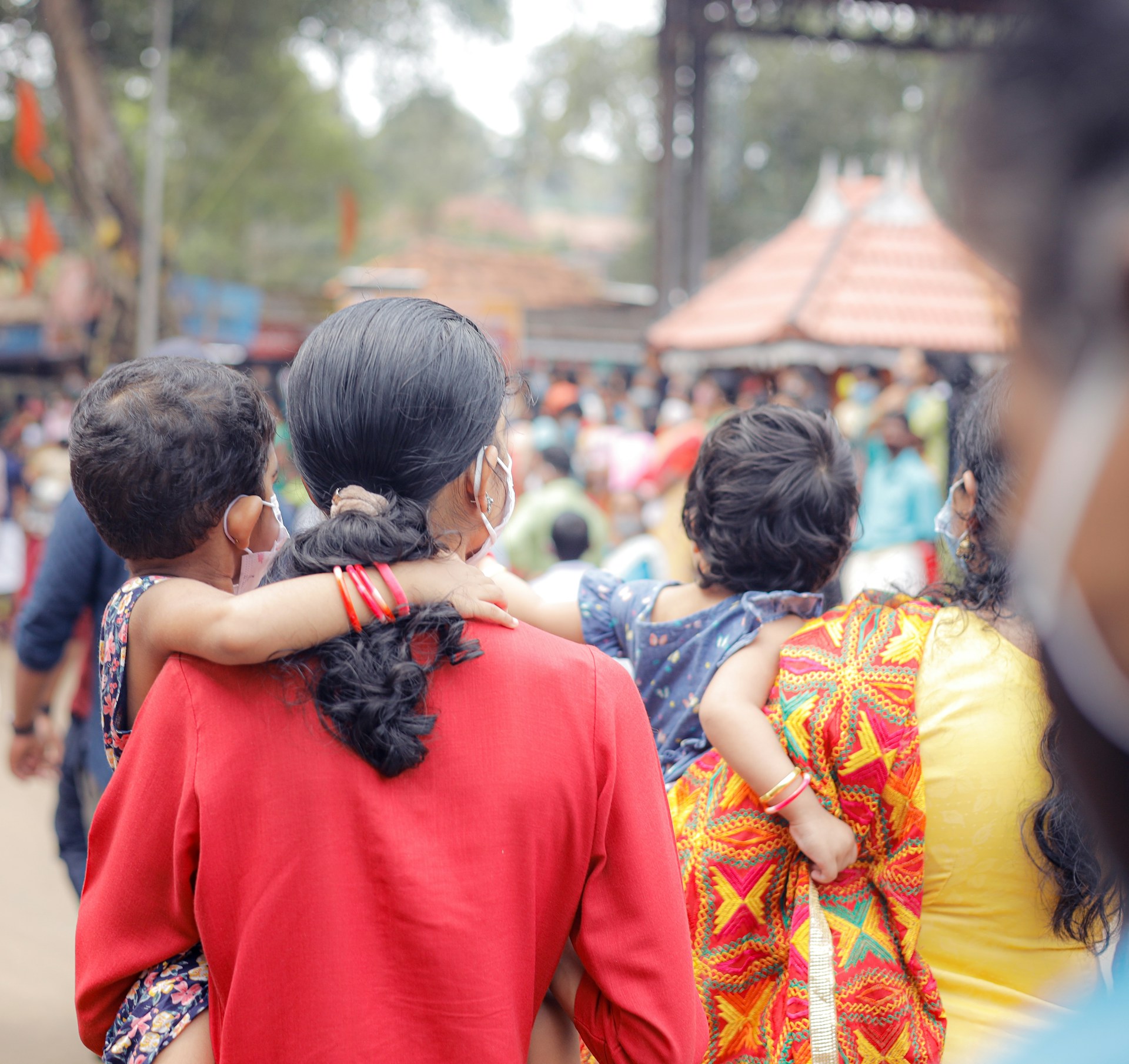 a group of people walking down a street