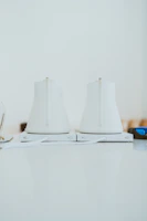 A close-up of a sleek Voltaris electric kettle glowing warmly on a kitchen counter.
