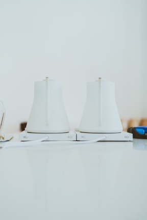 A close-up of a sleek electric kettle on a countertop.