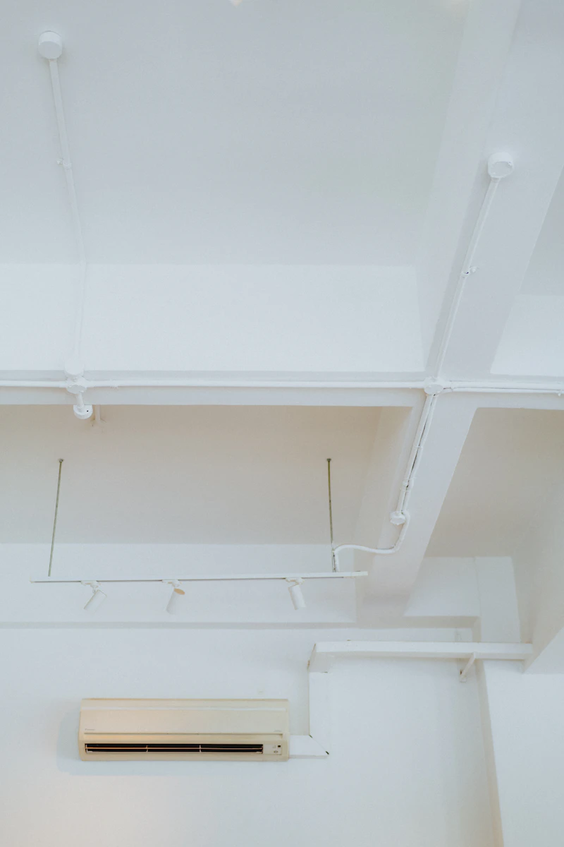 Clean indoor split air conditioning unit installed in a bright residential interior