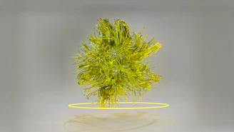 a green plant with yellow rings around it
