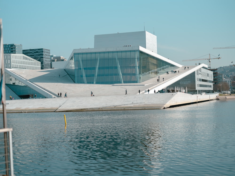 a body of water with a building in the background