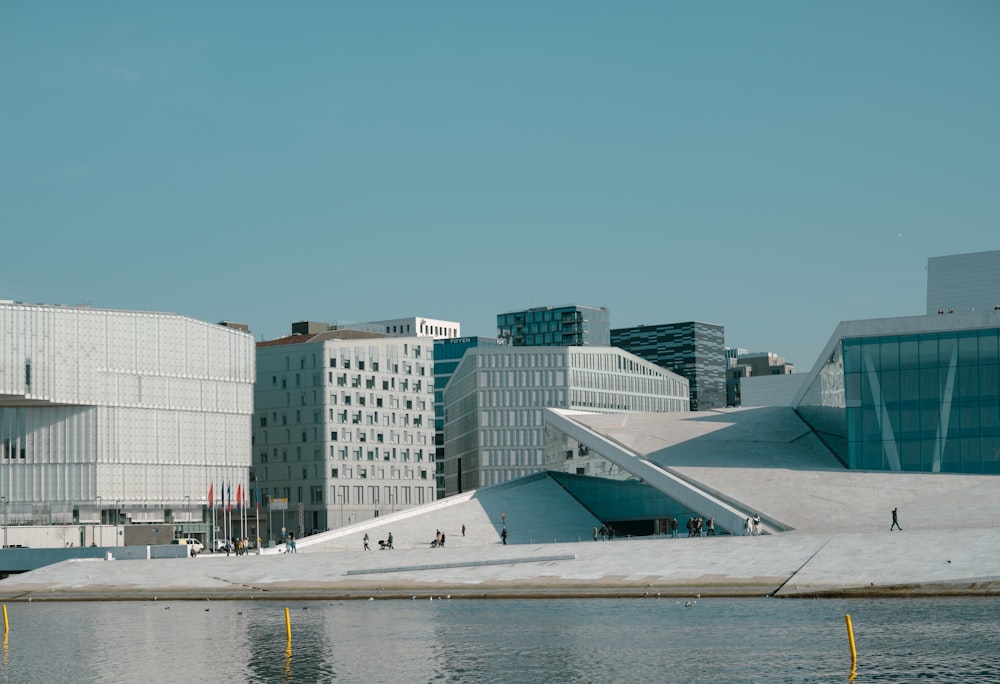 a body of water with buildings in the background