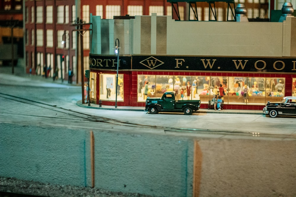 a model of a street scene with cars and people