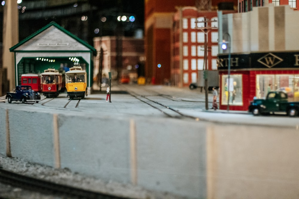a model of a train station with a train on the tracks