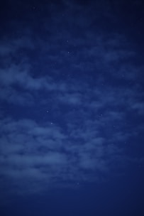 A serene night sky filled with stars forming zodiac constellations.