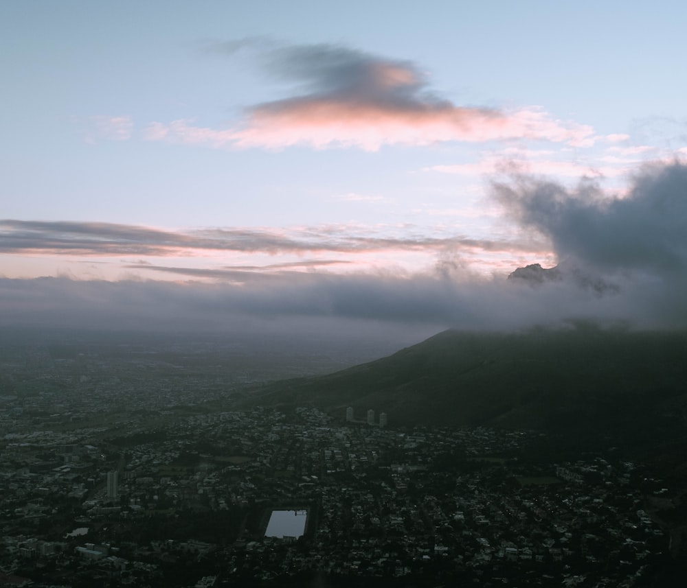 a view of a city with a mountain in the background