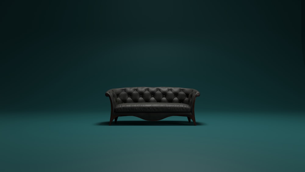 a brown leather couch sitting on top of a green floor
