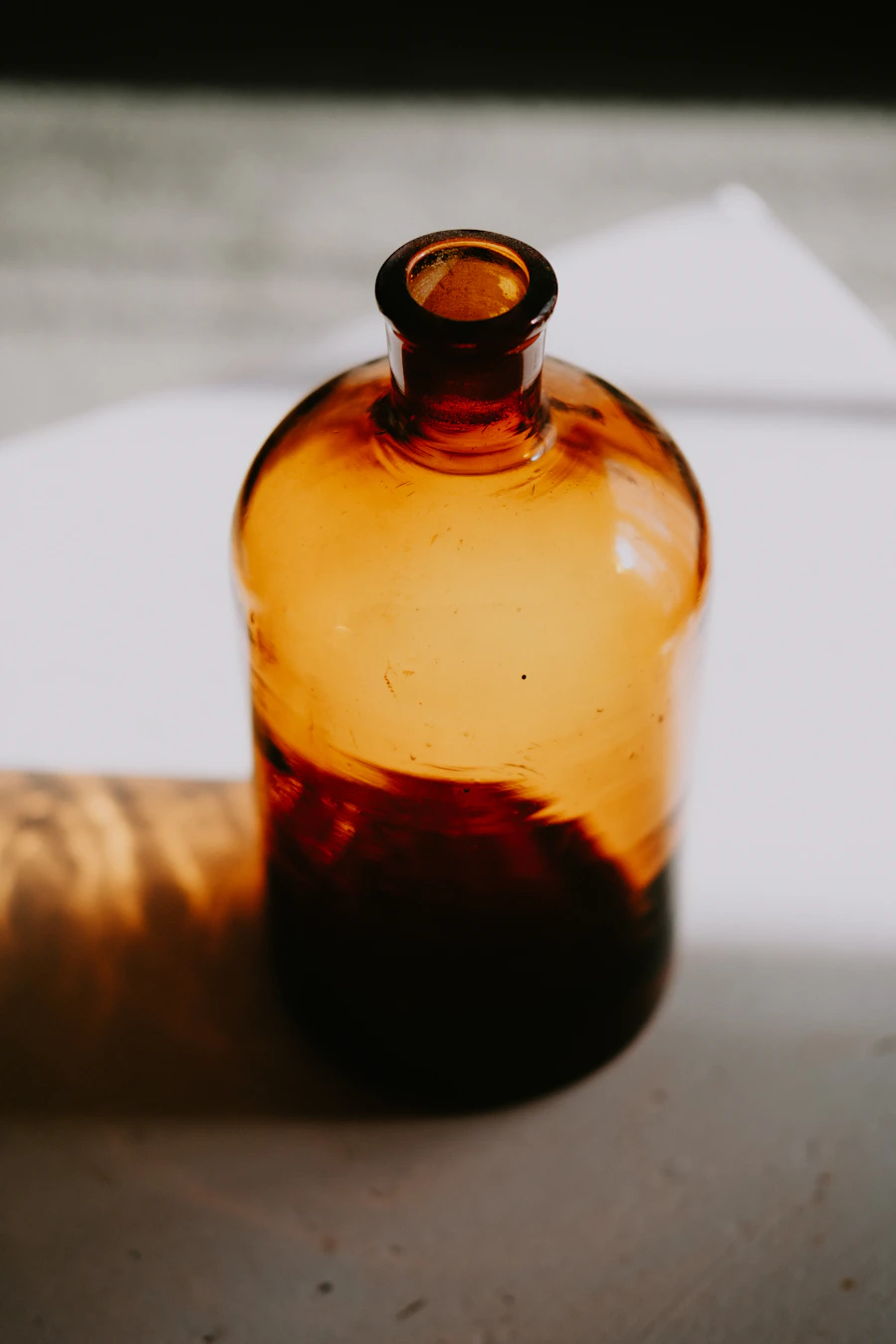 Amber glass bottle of cold-pressed natural oil