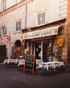 A cozy Italian restaurant with a beautifully designed website displayed on a laptop.