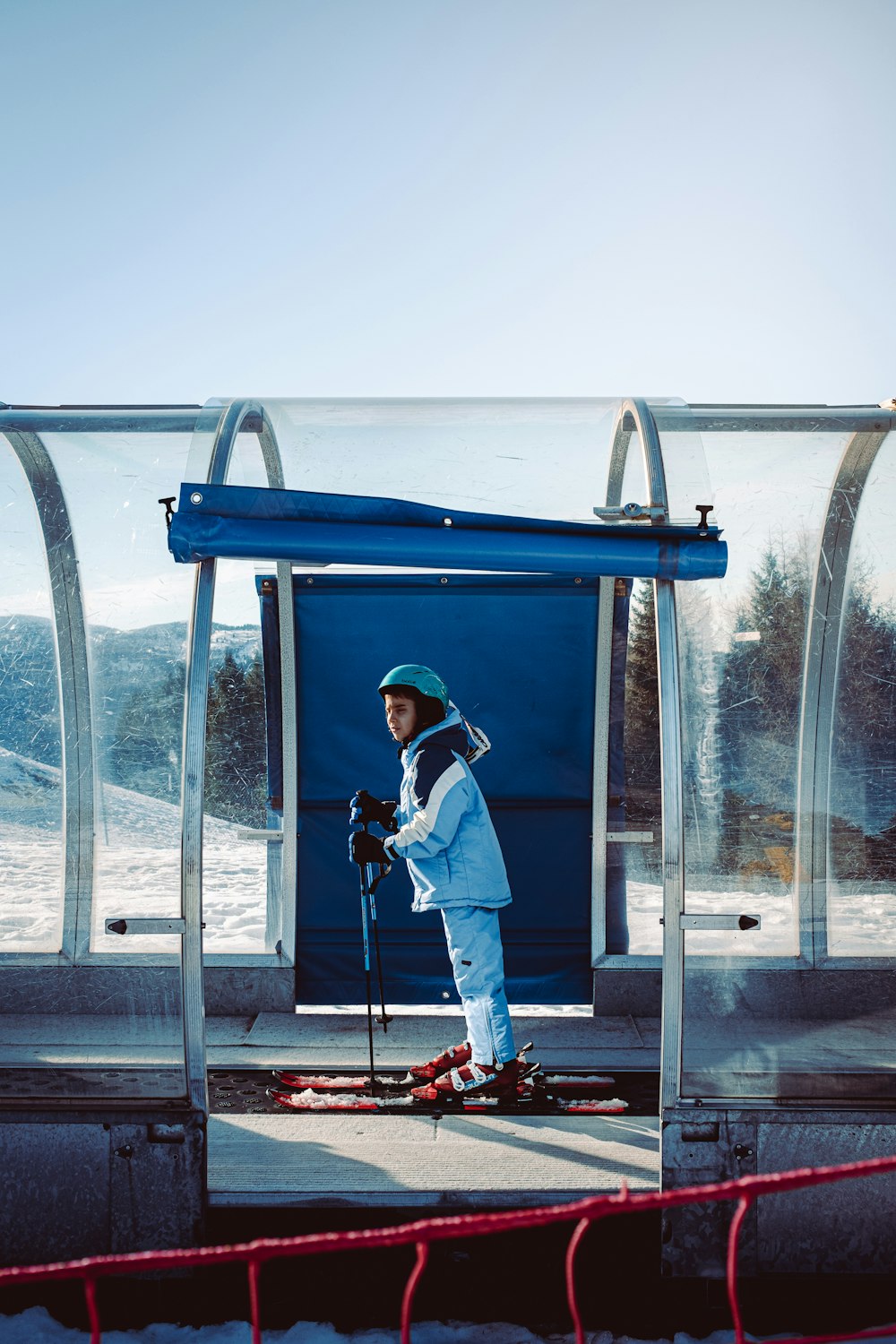 a man riding skis on top of a snow covered ground