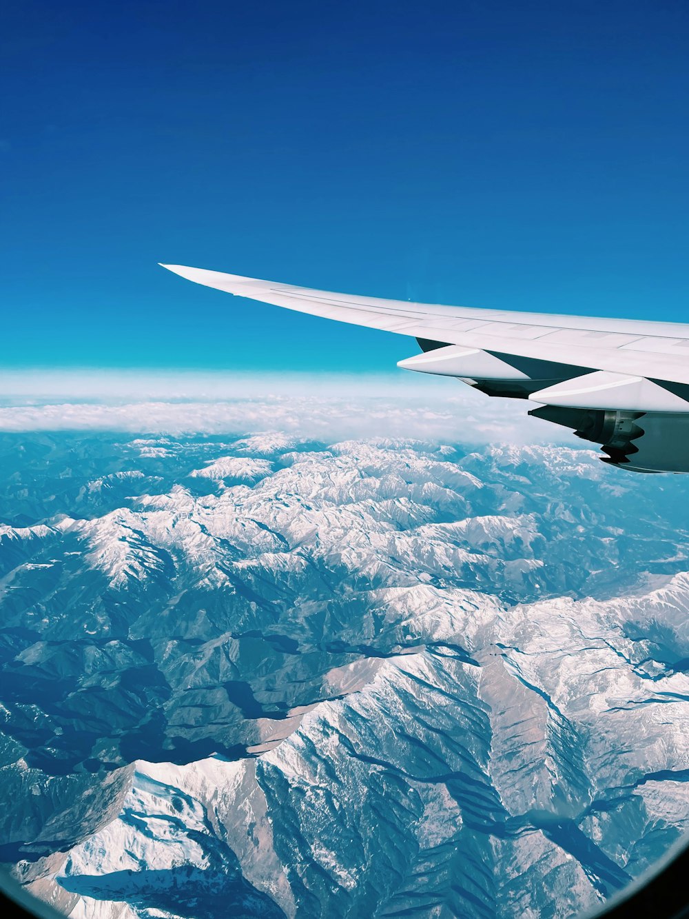 a view of a mountain range from an airplane window