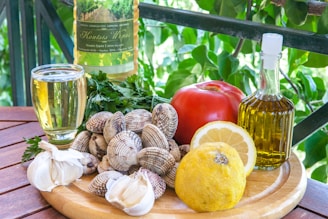a plate of food and a bottle of wine on a table