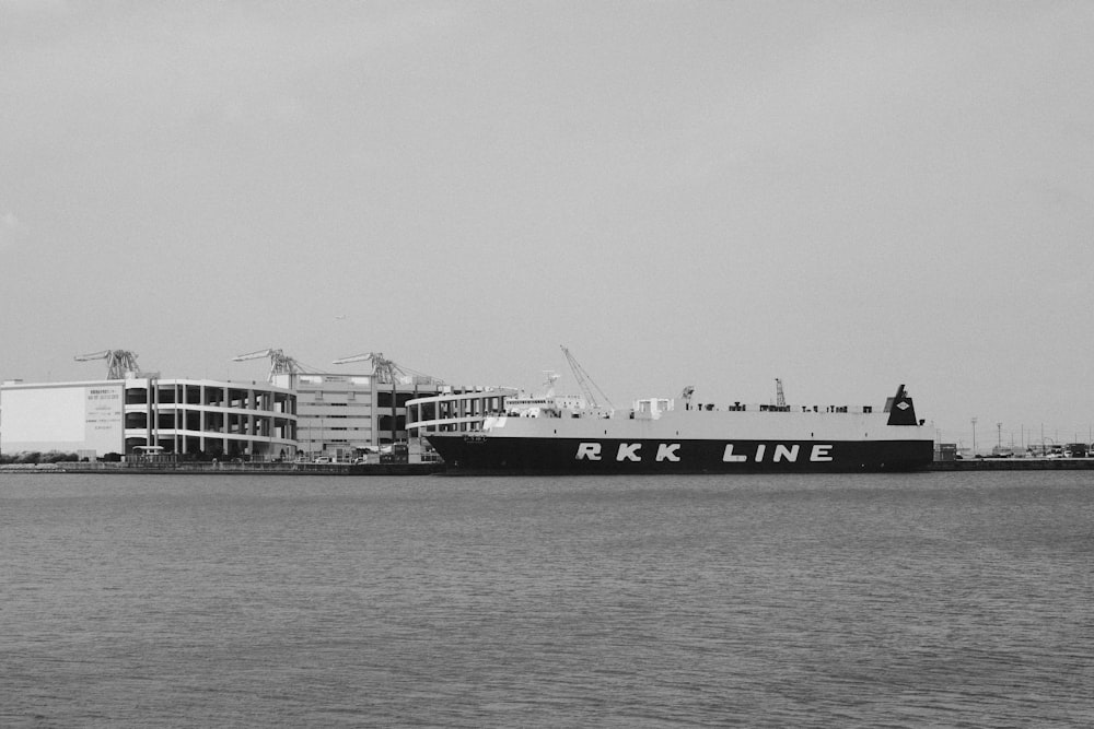 a large black and white boat on a body of water