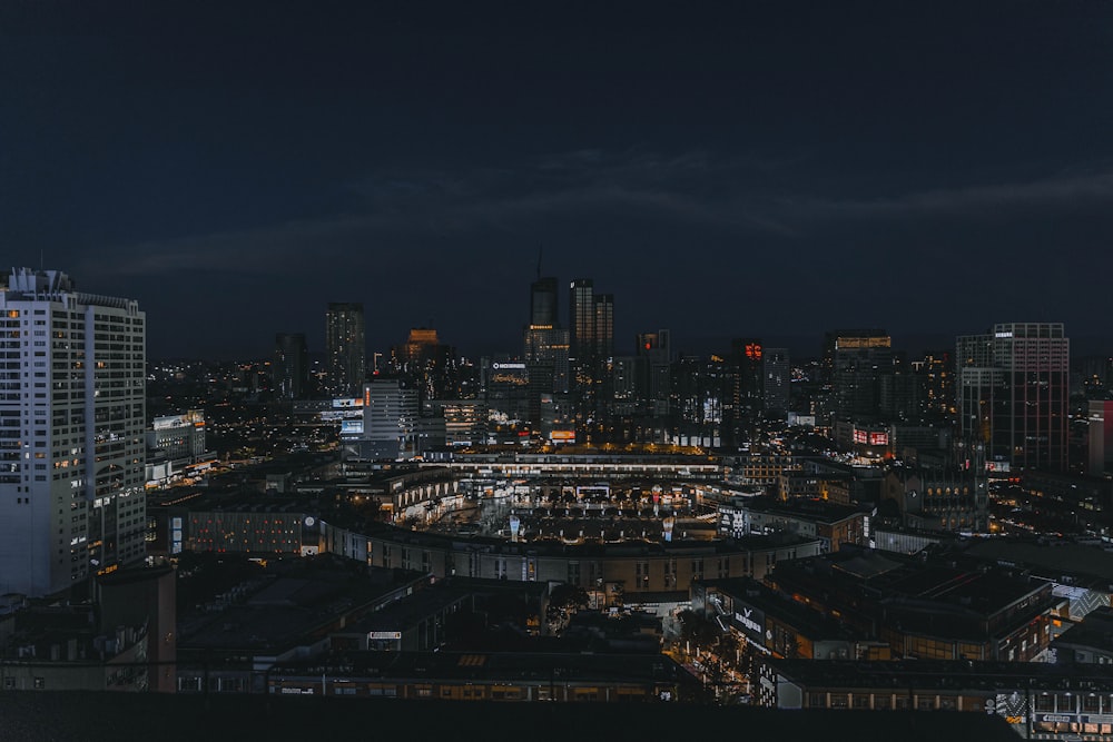 a view of a city at night from the top of a building