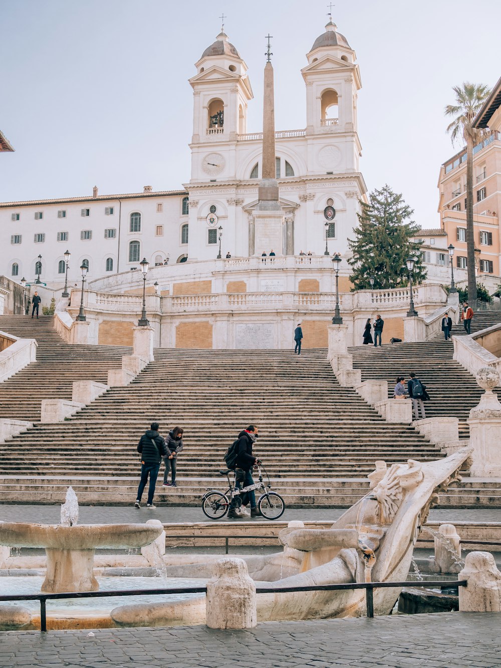 a man riding a bike down some steps