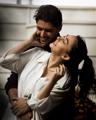 a man and a woman embracing each other