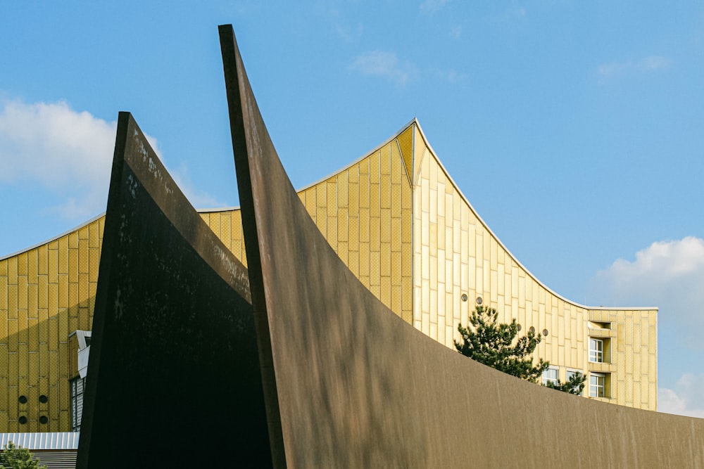 a large metal sculpture in front of a building