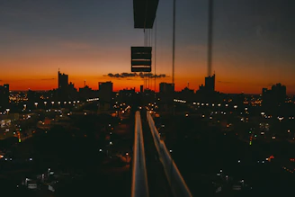 Timelapse style shot of a cityscape transitioning from day to night.