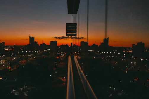 Timelapse style shot of a cityscape transitioning from day to night.