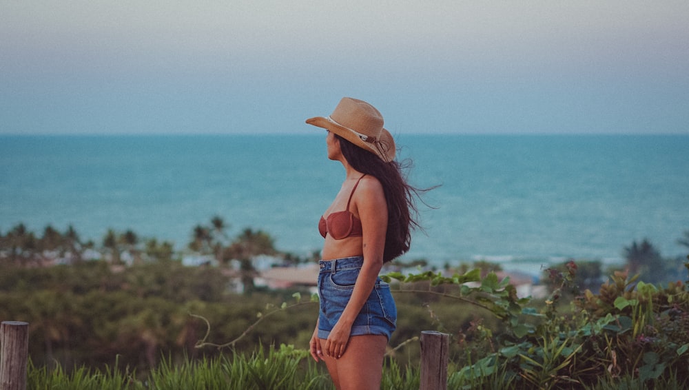 a person standing in front of a body of water