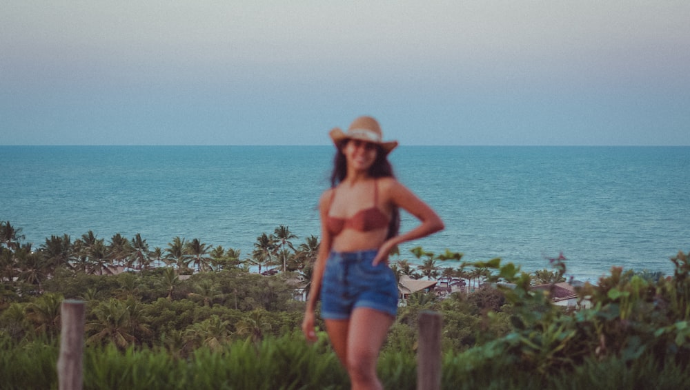 a person standing in front of a body of water