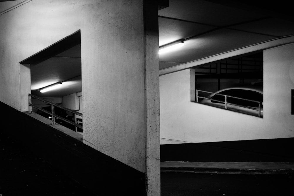 a black and white photo of a parking garage