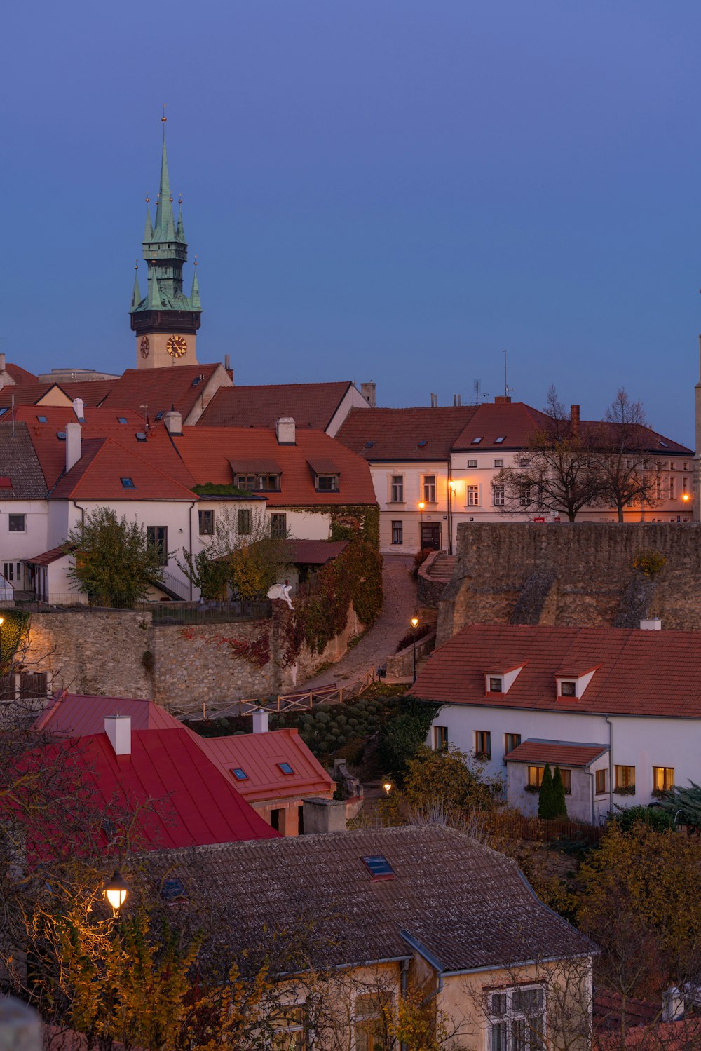 a view of a city with a clock tower in the background