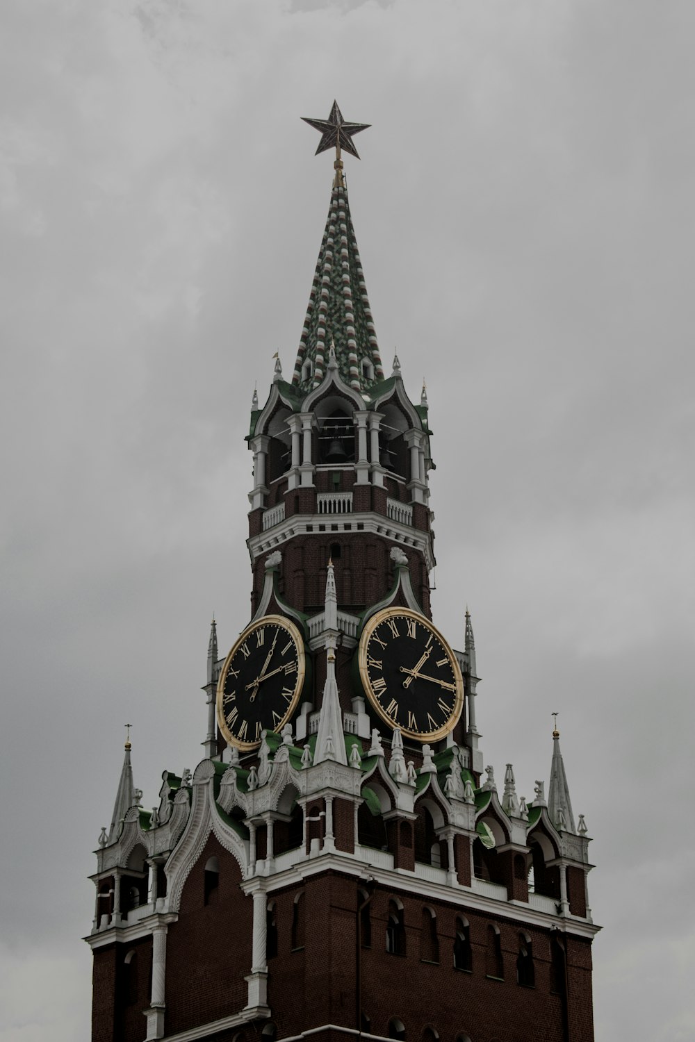 a large tall tower with a clock on the side of a building
