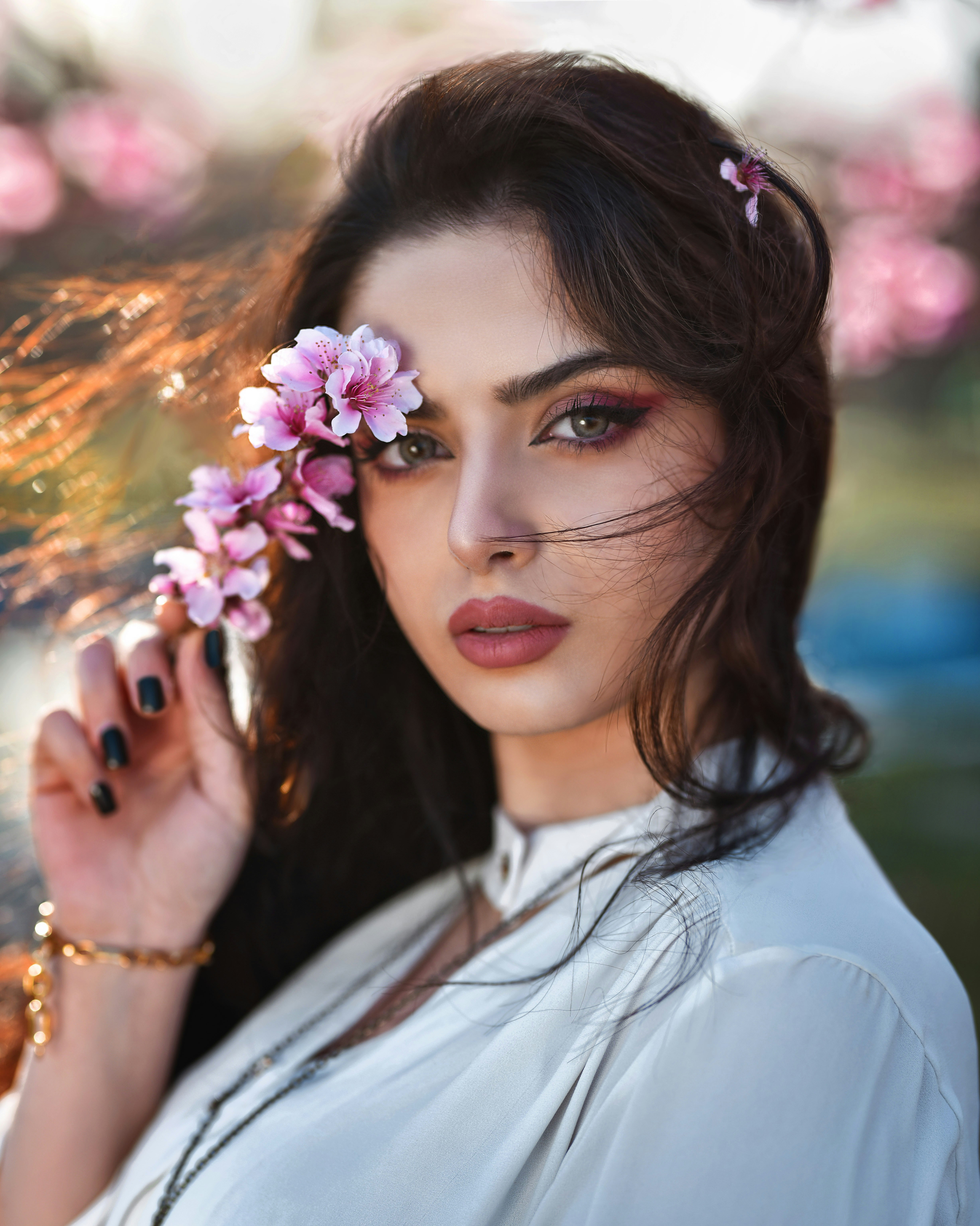a woman with a flower in her hair