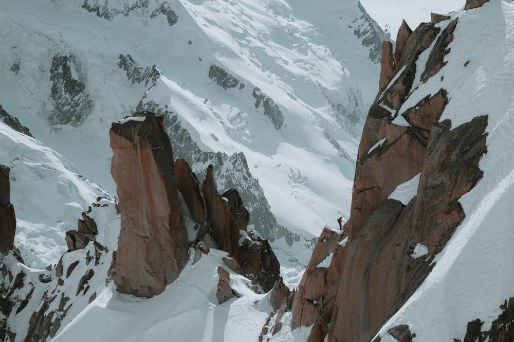 a person skiing down a snowy mountain side