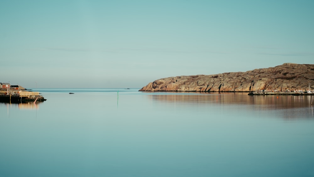 a body of water with a small island in the background