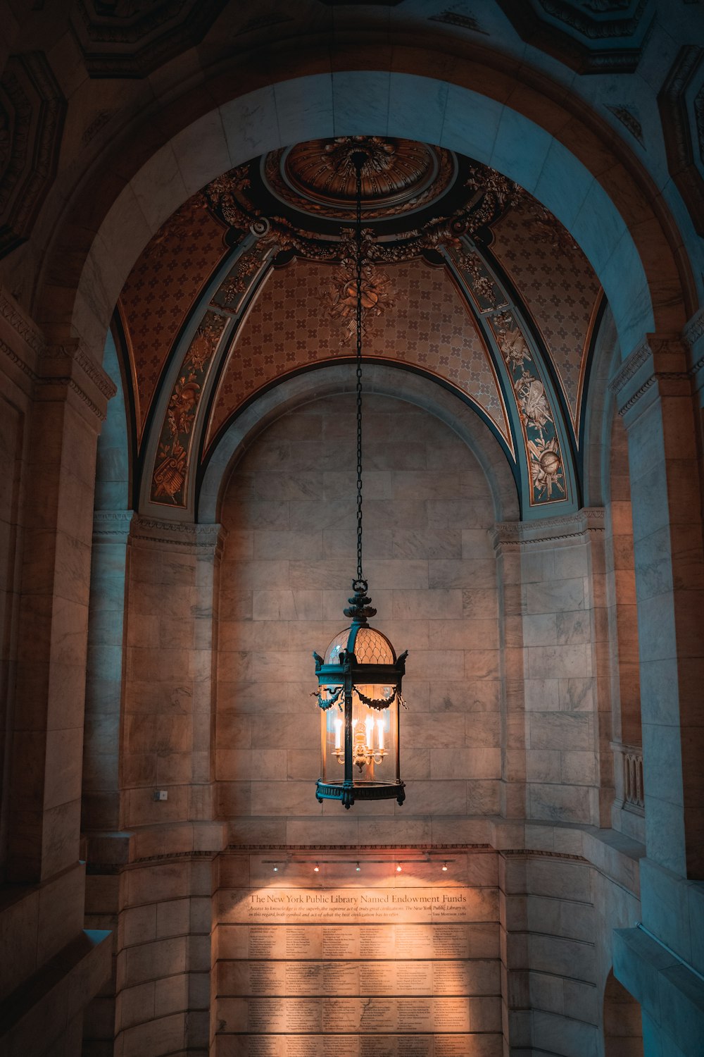 a light hanging from a ceiling in a building