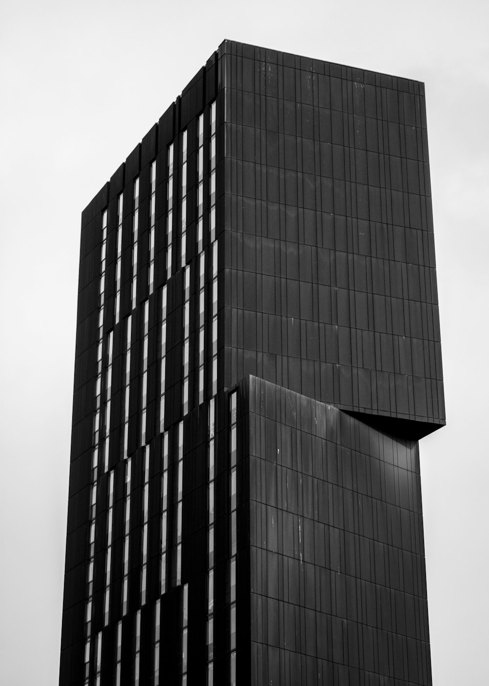 a black and white photo of a tall building