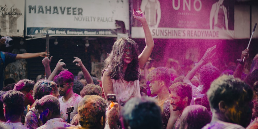 a group of people covered in colored powder