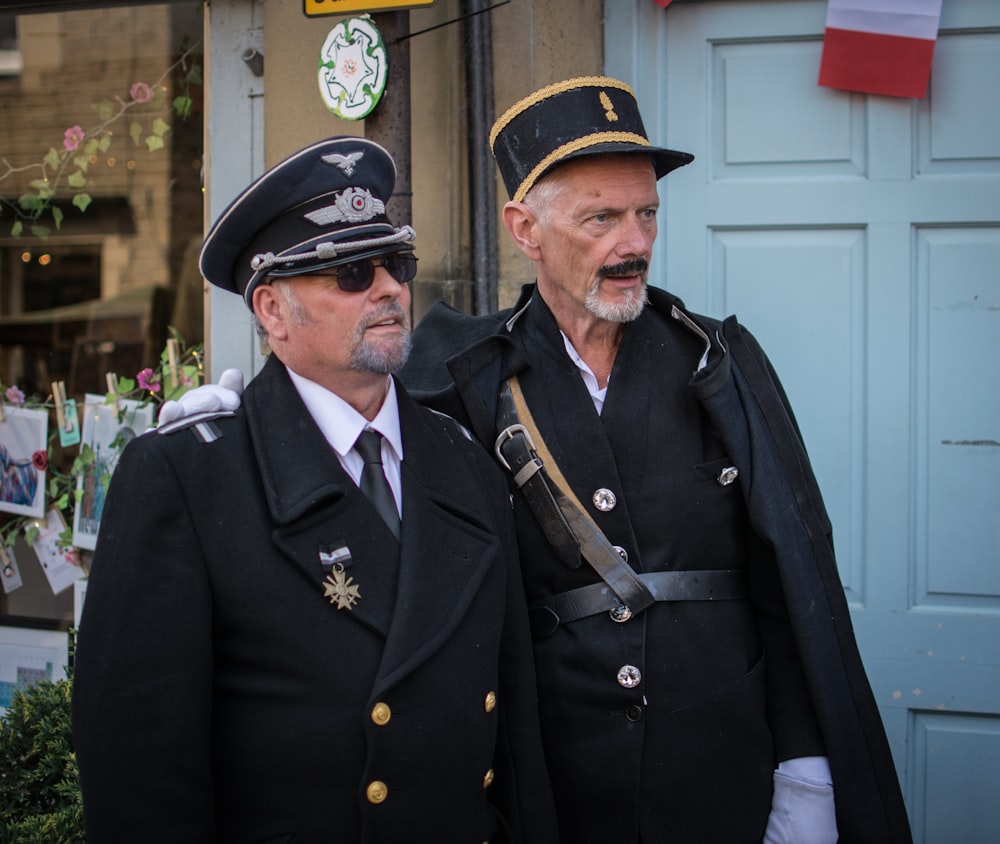 a couple of men standing next to each other