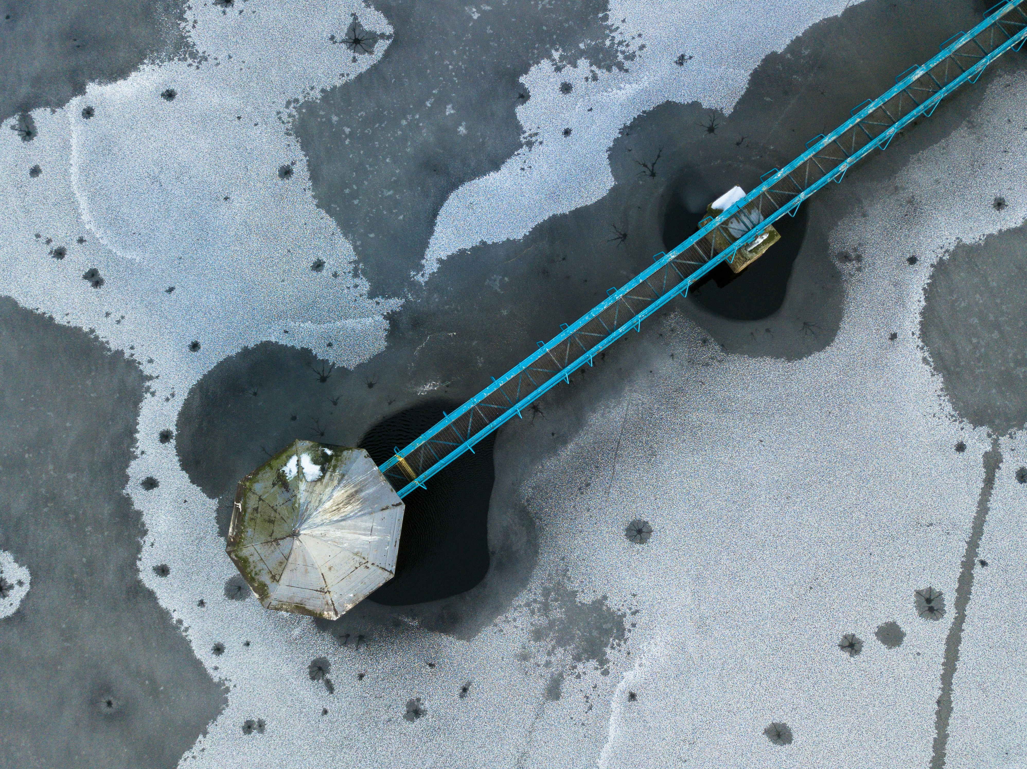 a pair of black and blue poles and a white umbrella