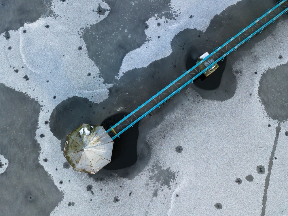 a pair of black and blue poles and a white umbrella