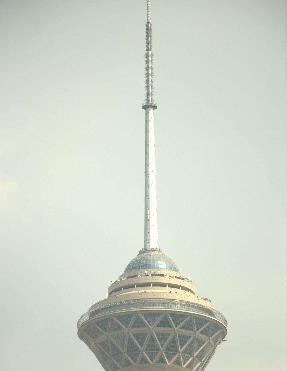 a very tall tower with a clock on it's side