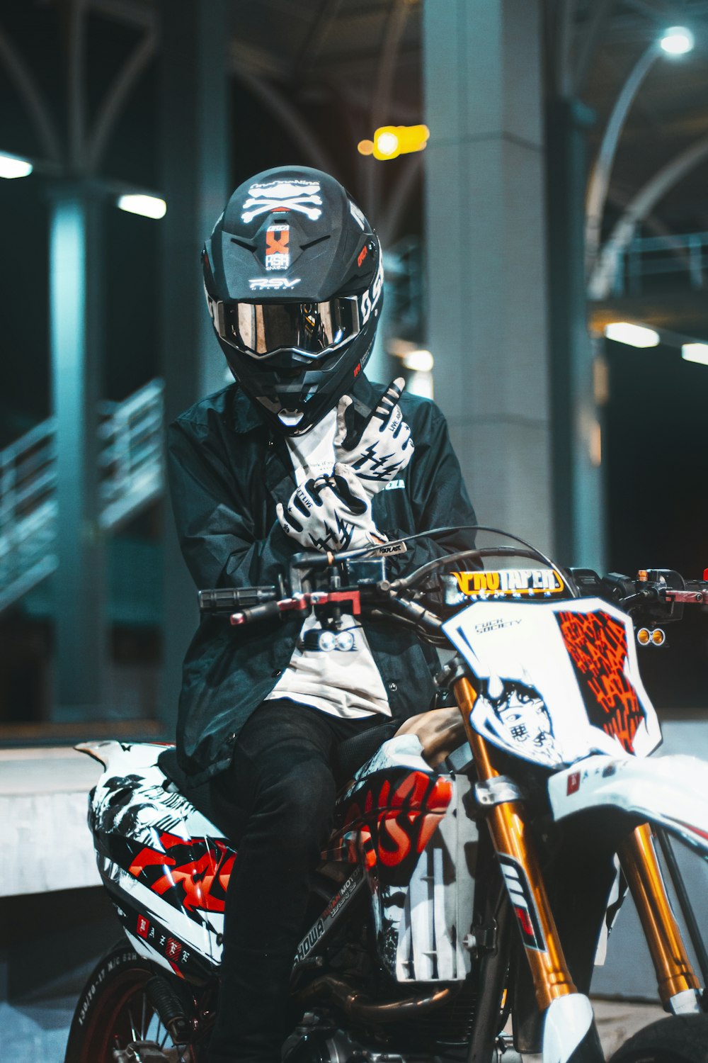 a man sitting on a motorcycle in a building