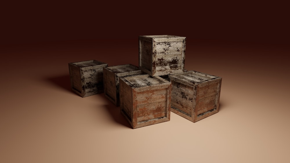 a group of wooden boxes sitting on top of a brown floor