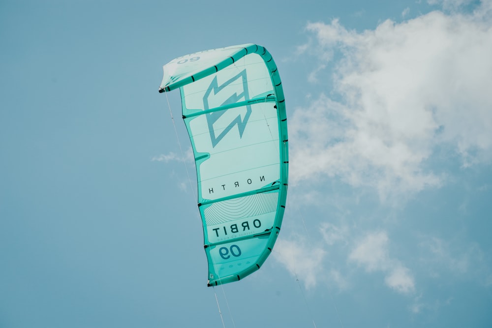 a person is parasailing in the blue sky