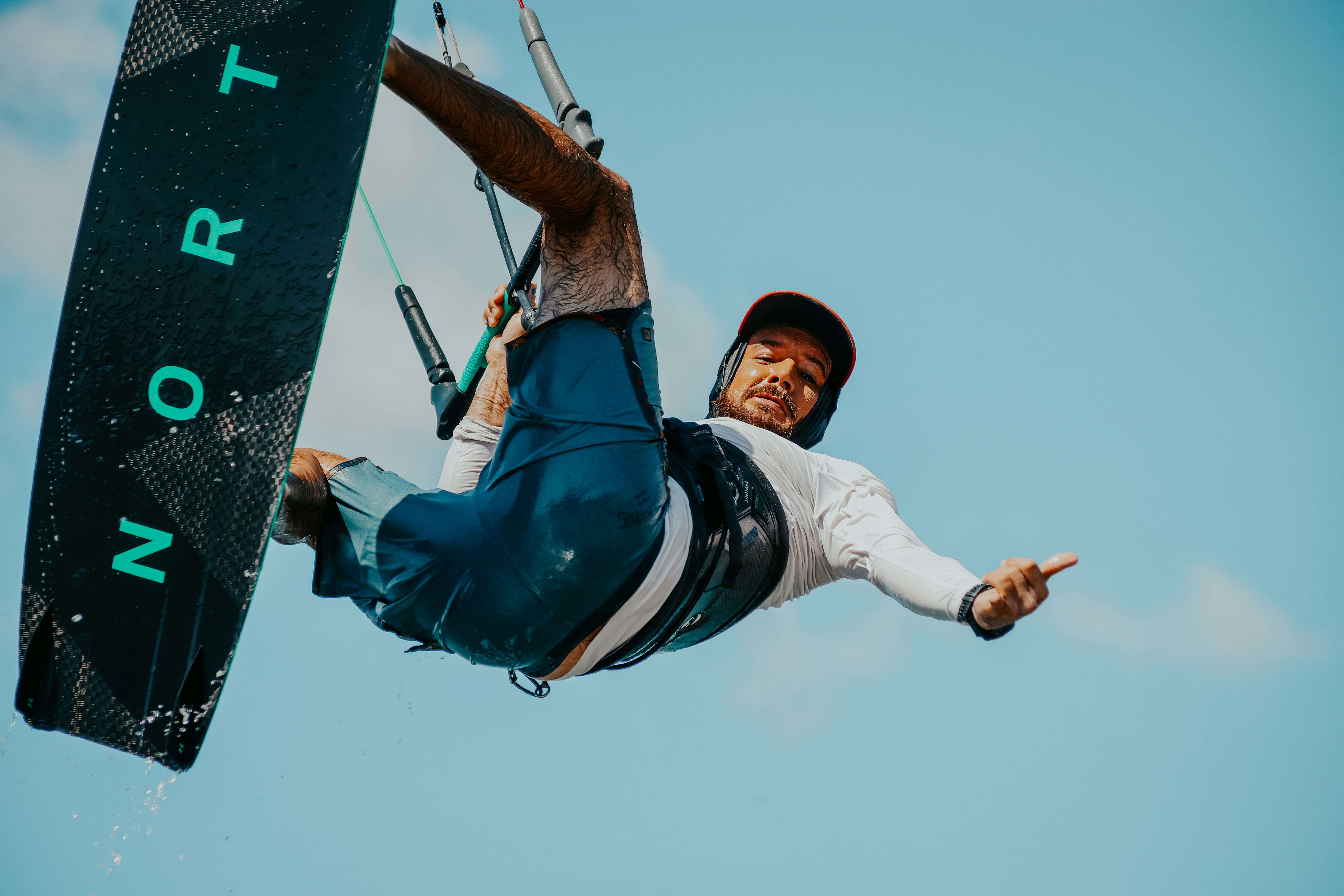 a man riding a kiteboard on top of a body of water