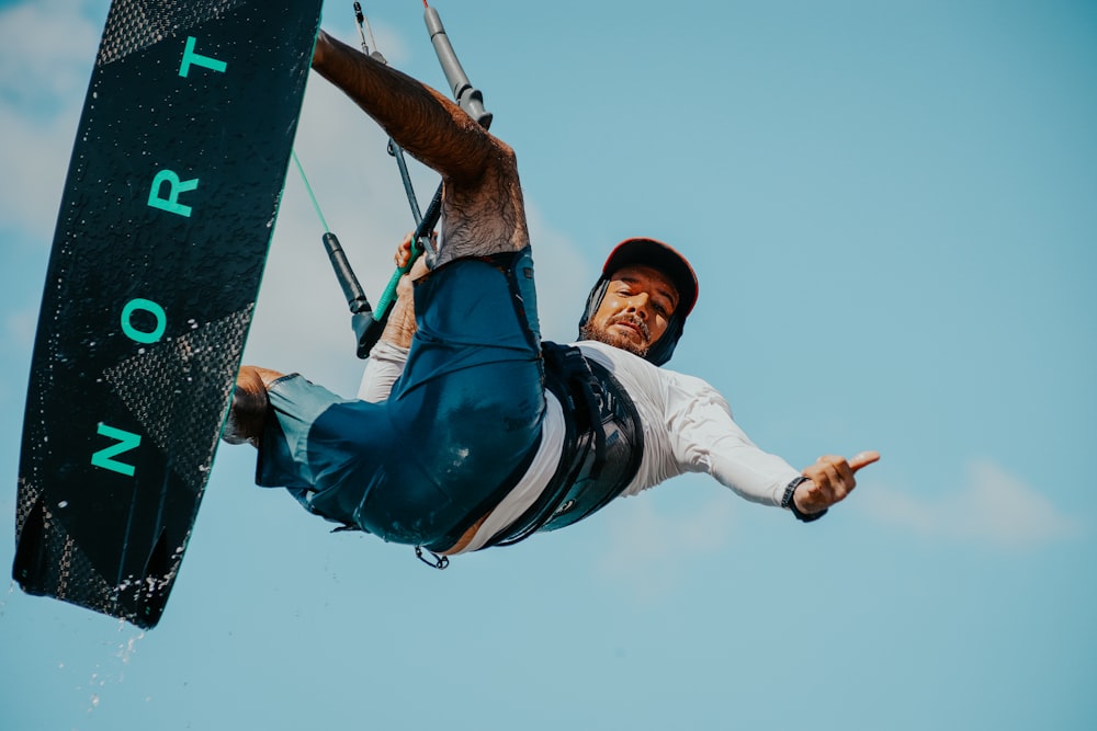 a man riding a kiteboard on top of a body of water