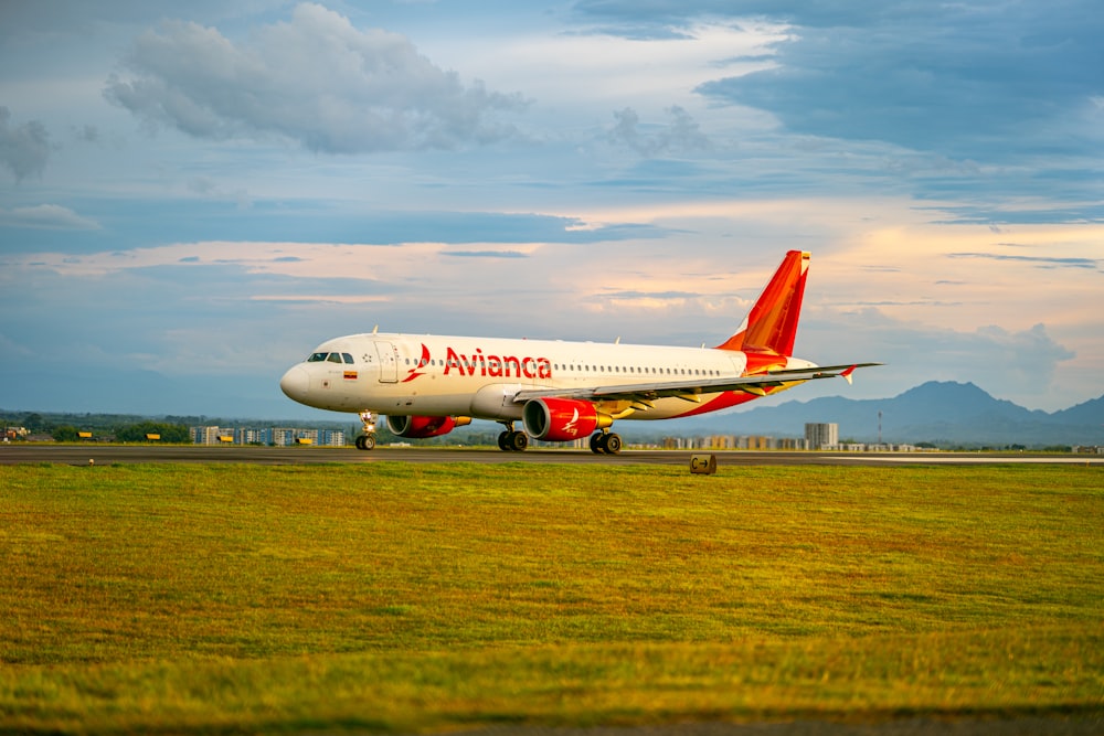 a large jetliner sitting on top of an airport runway