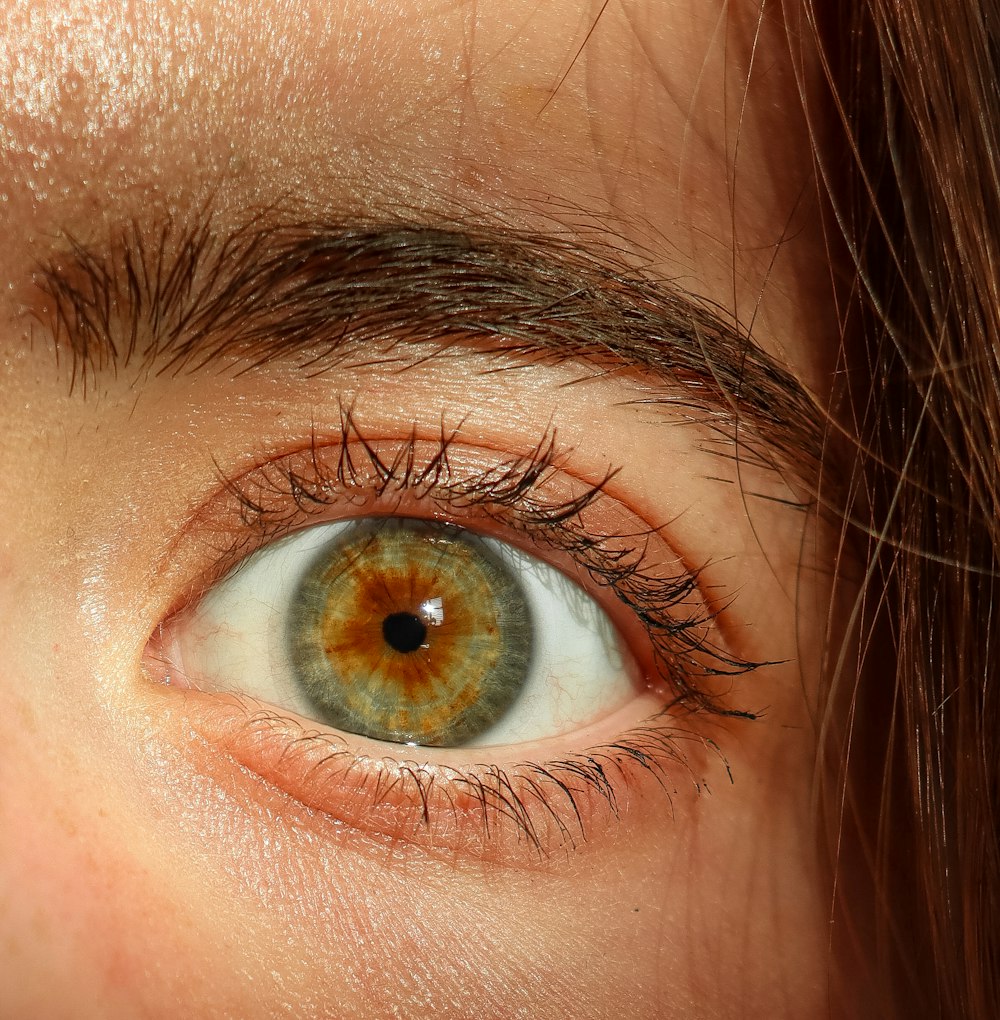 a close up of a person's brown eye